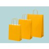 Yellow paper bags with twisted paper handle