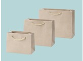 Luxury paper bags covered with cream coloured suede