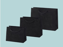 Luxury paper bags covered with black suede